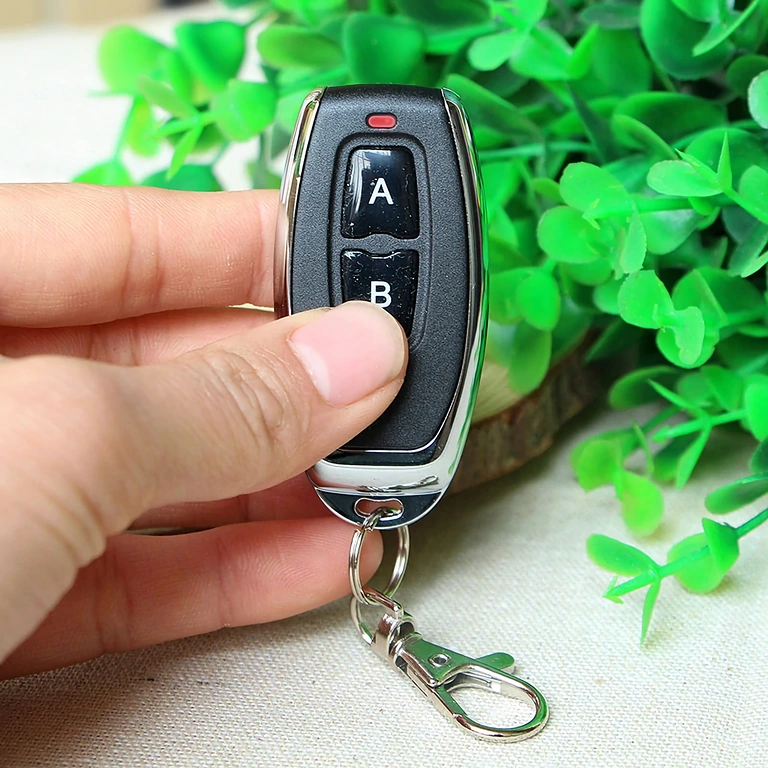 Kompakt modell med 2 knappar, 433MHz, lärbar kod 1527